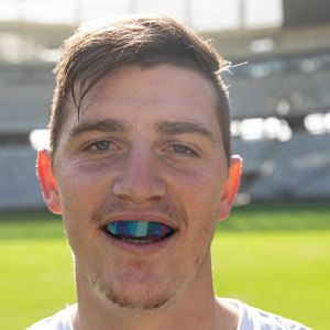 Man wears athletic mouthguard