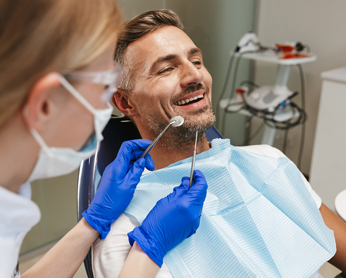 Man in dental chair for dental checkup
