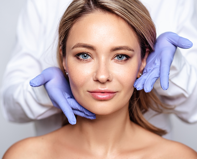 Woman having smooth facial skin presented by dentist