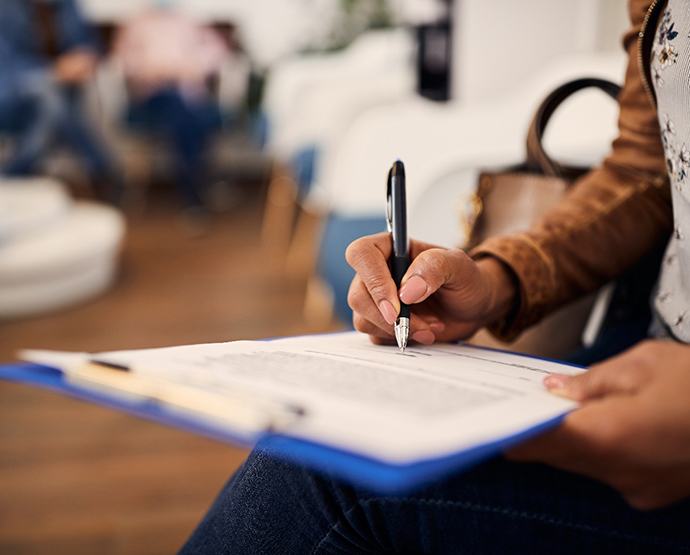 Patient filling out paperwork in lobby