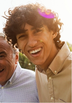 Close up of man in collared shirt smiling