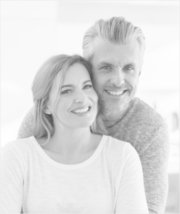 Man and woman standing and smiling