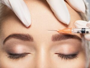 Young woman receiving BOTOX injection.
